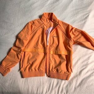 Figs scrubs On-Shift Bomber Jacket in Shaka orange limited edition